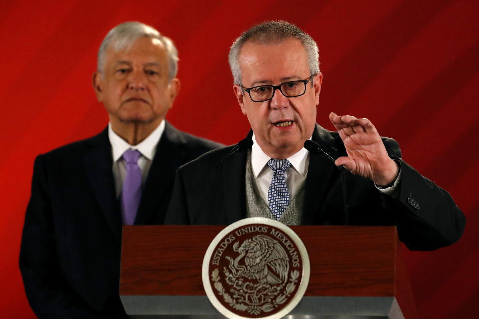 Mexico's Finance Minister Carlos Urzua speaks as President Andres Manuel Lopez Obrador looks on during a news conference to announce a plan to strengthen finances of state oil firm Pemex, at the National Palace in Mexico City, Mexico February 15, 2019. REUTERS/Henry Romero