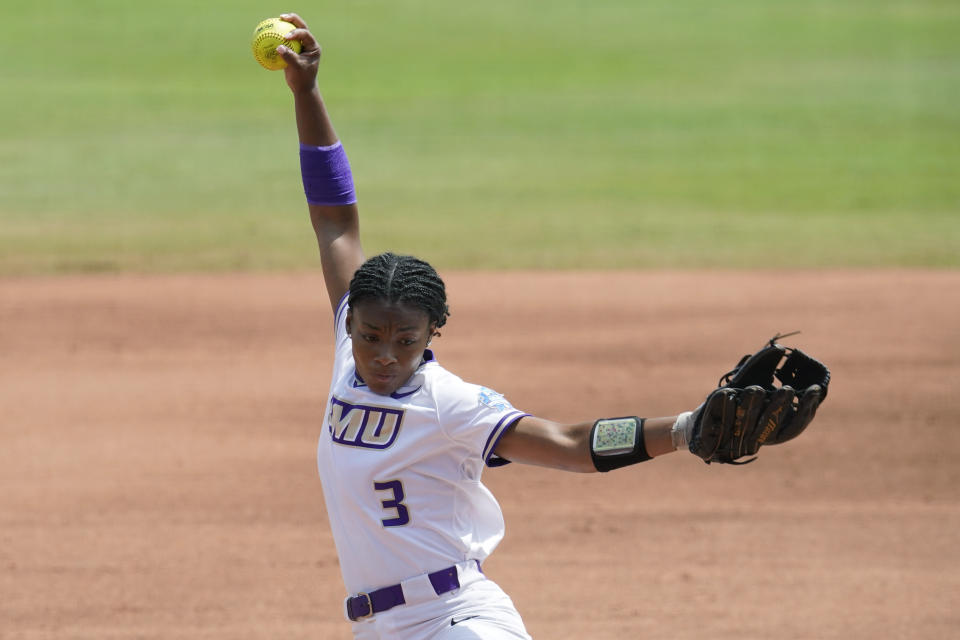 James Madison's Odicci Alexander pitches in the first inning an NCAA Women's College World Series softball game against Oklahoma, Sunday, June 6, 2021, in Oklahoma City. (AP Photo/Sue Ogrocki)