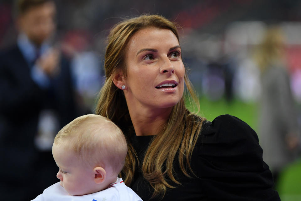 LONDON, ENGLAND - NOVEMBER 15:  Coleen Rooney holding Cass Mac Rooney looks on prior to the International Friendly match between England and United States at Wembley Stadium on November 15, 2018 in London, United Kingdom.  (Photo by Shaun Botterill/Getty Images)