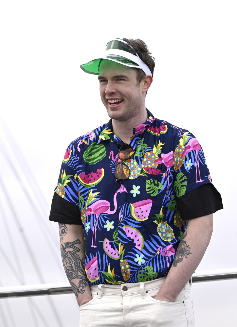 Ed Gamble, wearing a loud fruit-print tropical shirt and a visor, during the 