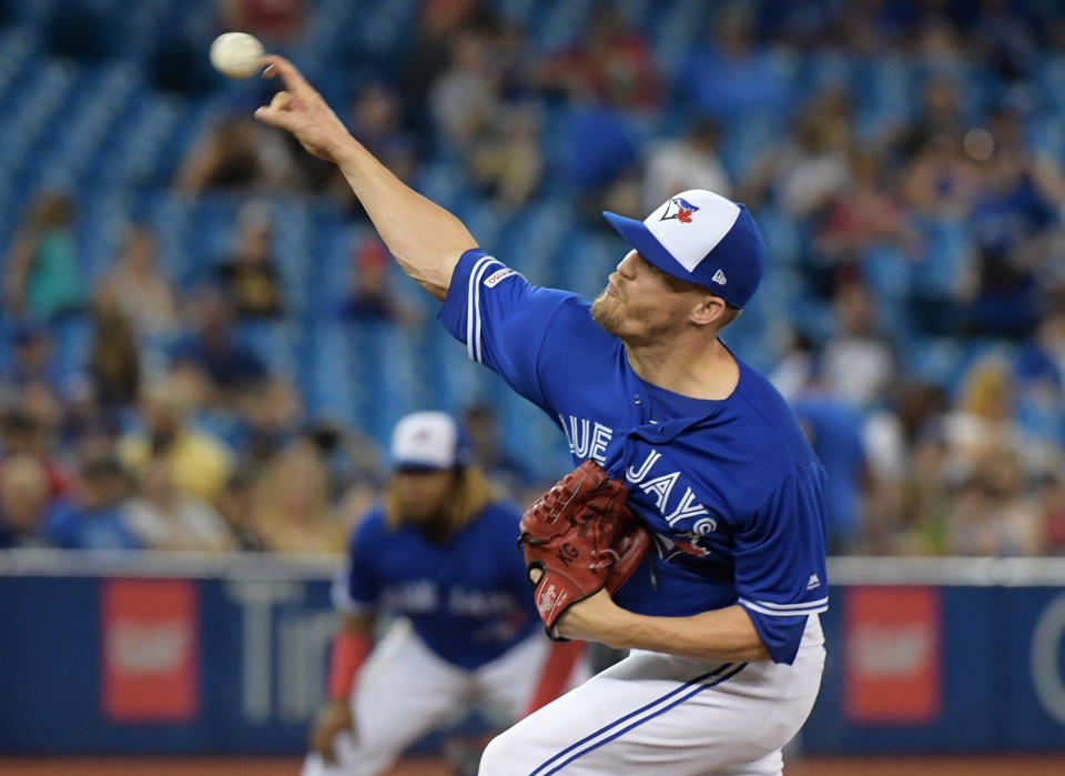 Jul 27, 2019; Toronto, Ontario, CAN;  Toronto Blue Jays relief pitcher Ken Giles (51) delivers a pitch against Tampa Bay Rays in the tenth inning at Rogers Centre. Mandatory Credit: Dan Hamilton-USA TODAY Sports