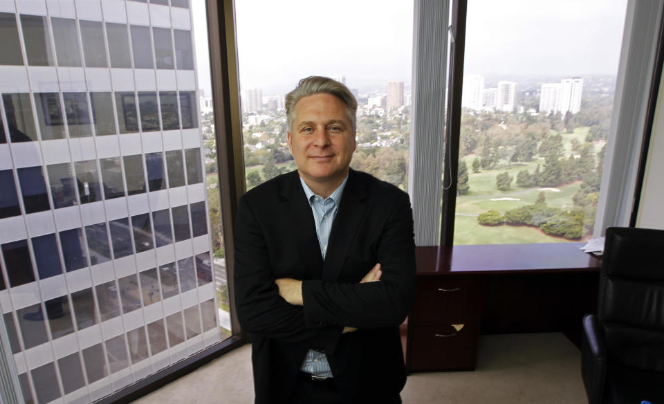 In this Sept. 12, 2012, photo, Joe Fox, CEO of Ditto Trade, poses in his offices in Los Angeles. Ditto Trade is a new online brokerage firm where one can attach their stock portfolio to that of person they trust, so that when they make a trade, so will you. (AP Photo/Reed Saxon)