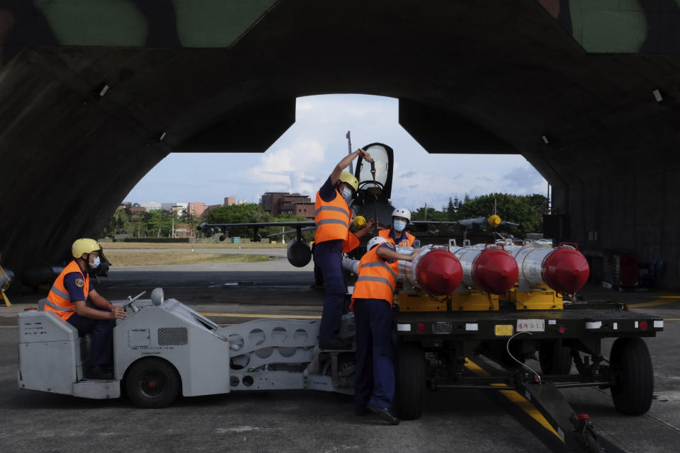 Military personnel prepare to load Harpoon A-84, anti-ship missiles on a F16V fighter jet at the Hualien Airbase in Taiwan's southeastern Hualien county on Wednesday, Aug. 17, 2022. Taiwan is staging military exercises to show its ability to resist Chinese pressure to accept Beijing's political control over the island. (AP Photo/Johnson Lai)