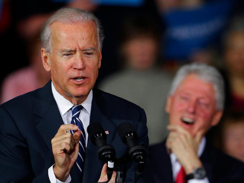 Former president Bill Clinton laughs as Vice President Joe Biden speaks during a campaign rally at the Covelli Centre, Monday, Oct. 29, 2012, in Youngstown, Ohio.