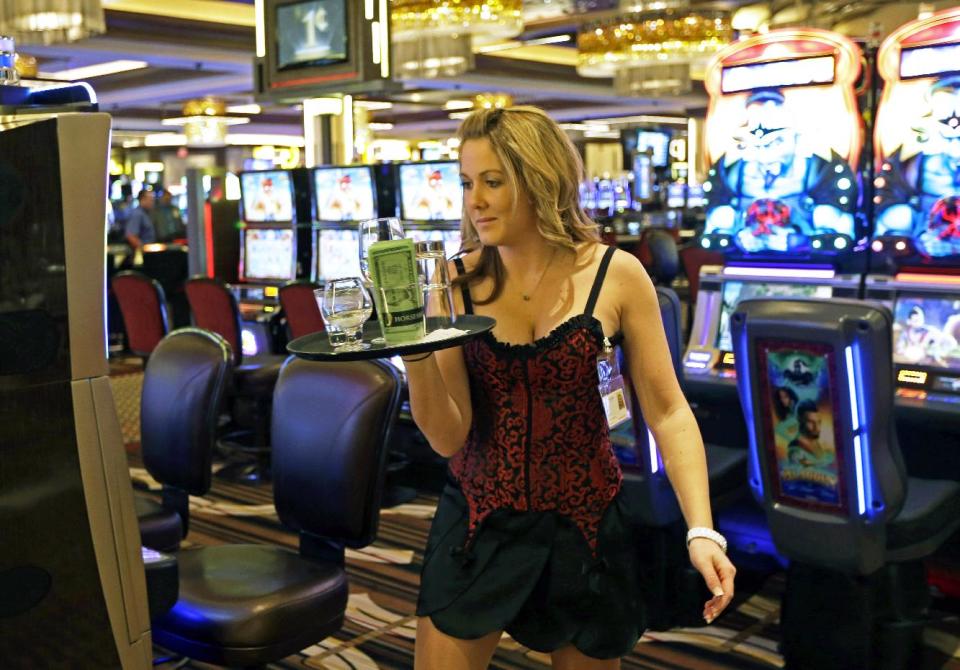 A beverage server practices inside Horseshoe Casino Cincinnati, Tuesday, Feb. 26, 2013, in Cincinnati. The casino with a 100,000 foot gaming floor is set to open to the public Monday, March 4. (AP Photo/Al Behrman)