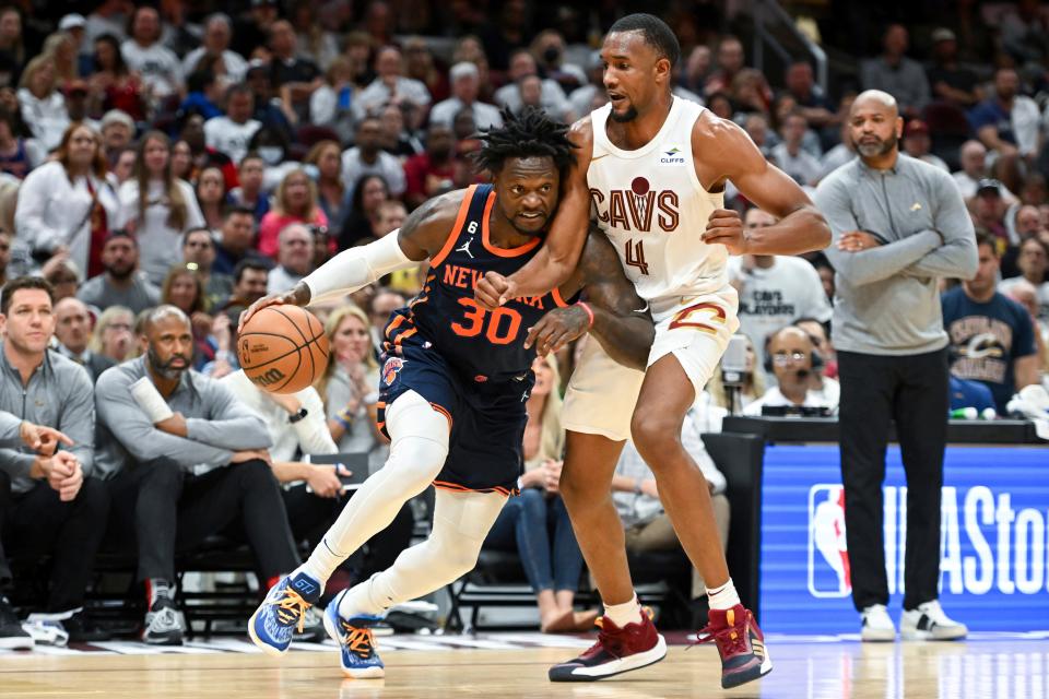New York Knick' Julius Randle (30) drives against Cleveland Cavaliers' Evan Mobley (4) in the second half during Game 1 in the first round of the NBA basketball playoffs, Saturday, April 15, 2023, in Cleveland.
