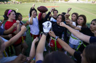 Elsa Morin, 17, center right, leads a chant as Redondo Union High School girls try out for a flag football team on Thursday, Sept. 1, 2022, in Redondo Beach, Calif. Southern California high school sports officials will meet on Thursday, Sept. 29, to consider making girls flag football an official high school sport. This comes amid growth in the sport at the collegiate level and a push by the NFL to increase interest. (AP Photo/Ashley Landis)