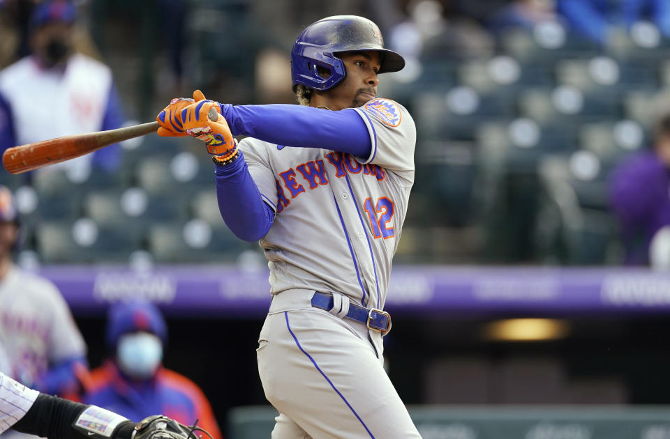 New York Mets' Francisco Lindor watches his single that drove in the go-ahead run off Colorado Rockies relief pitcher Daniel Bard during the seventh inning of a baseball game Saturday, April 17, 2021, in Denver. The Mets won 4-3 in the first game of a doubleheader. (AP Photo/David Zalubowski)