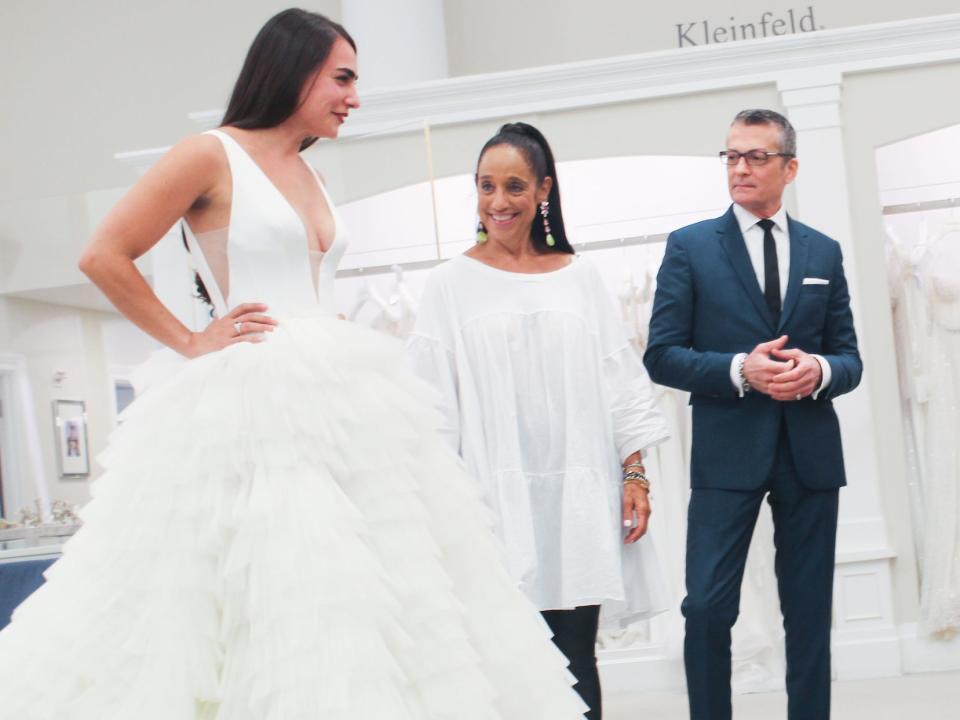 Randy Fenoli looks at a bride at Kleinfeld.