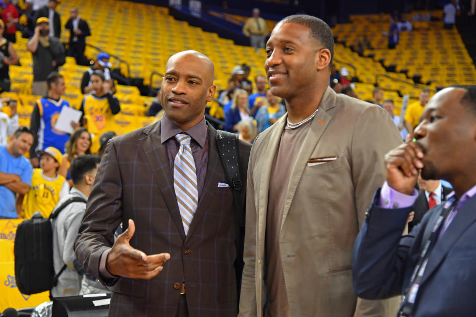 Vince Carter and Tracy McGrady in a sports arena