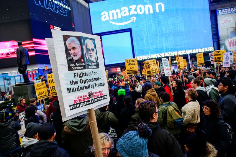 People take part in an anti-war protest amid increased tensions between the United States and Iran at Times Square in New York