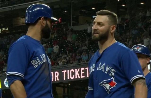 Kevin Pillar (right) is ushered back to the Blue Jays dugout by teammate Jose Bautista after a heated confrontation with Braves reliever Jason Motte. (MLB.TV)