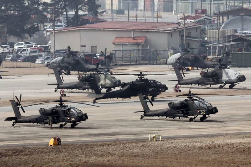 Apache choppers take off at Camp Humphreys, to join the Freedom Shield 2024 exercise. -/YNA/dpa