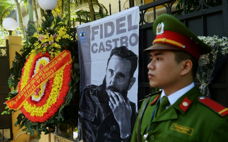 A wreath from Vietnam Communist Party Secretary General Nguyen Phu Trong is seen next to a large portrait of Fidel Castro in front of the Cuban embassy in Hanoi