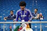 <p>Japan’s supporter picking up litter after their 2018 FIFA World Cup Round of 16 football match against Belgium at Rostov Arena Stadium. Team Belgium won the game 3:2. Valery Sharifulin/TASS (Photo by Valery Sharifulin\TASS via Getty Images) </p>