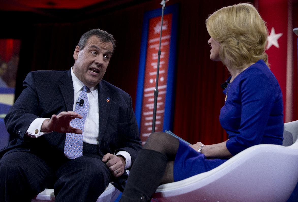 New Jersey Gov. Chris Christie speaks with Laura Ingraham during the Conservative Political Action Conference (CPAC) in National Harbor, Md., Thursday, Feb. 26, 2015. (AP Photo/Carolyn Kaster)