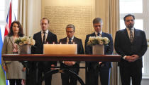 Francois-Philippe Champagne, Canada Minister of Foreign Affairs, centre, Ukraine Minister of Foreign Affairs Vadym Prystaiko, second right, United Kingdoms Secretary of State for Foreign Affairs Dominic Raab, second left, Sweden's Minister of Foreign Affairs Ann Linde, left, and Afghanistan's Foreign Minister Idrees Zaman, hold a minute of silence behind candles and in front of a plaque with the names of the victims of flight PS752, at the High Commission of Canada in London, Thursday, Jan. 16, 2020. The Foreign ministers gather in a meeting of the International Coordination and Response Group for the families of the victims of PS752 flight crashed shortly after taking off from the Iranian capital Tehran on Jan. 8, killing all 176 passengers and crew on board.(AP Photo/Frank Augstein)