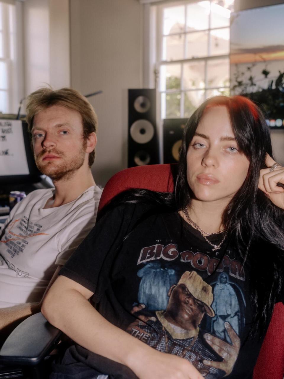 A male and female musician pose for a photo