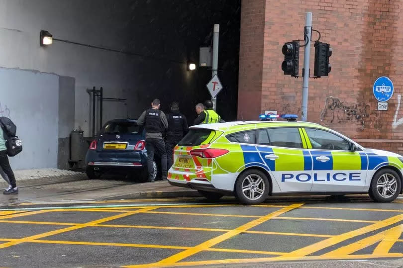 Police were called out after a car became stuck in the Metrolink tunnel at Piccadilly