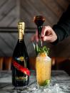 <p><strong>Ingredients</strong></p><p>2 oz G.H. Mumm Champagne<br>1.5 oz Jameson Black Barrel<br>.25 oz <a href="https://www.amazon.com/Torani-T221-Pineapple-Syrup-750mL/dp/B000GZGX8C/ref=sr_1_3?tag=syn-yahoo-20&ascsubtag=%5Bartid%7C10067.g.1261%5Bsrc%7Cyahoo-us" rel="nofollow noopener" target="_blank" data-ylk="slk:pineapple syrup;elm:context_link;itc:0;sec:content-canvas" class="link ">pineapple syrup</a><br>.5 oz lime juice<br>4-5 mint leaves</p><p><strong>Instructions</strong></p><p>In a highball glass, combine mint, pineapple syrup, and lime juice. Gently muddle the ingredients, and add in the whiskey. Top with crushed ice and light stir to combine to ingredients. Top with G.H. Mumm and add in more crushed ice. Dash 2-3 of angostura bitters on top, and garnish with pineapple leaves and mint. </p><p><em>By <a href="https://www.instagram.com/apartment_bartender/?hl=en" rel="nofollow noopener" target="_blank" data-ylk="slk:@ApartmentBartender;elm:context_link;itc:0;sec:content-canvas" class="link ">@ApartmentBartender </a></em></p>