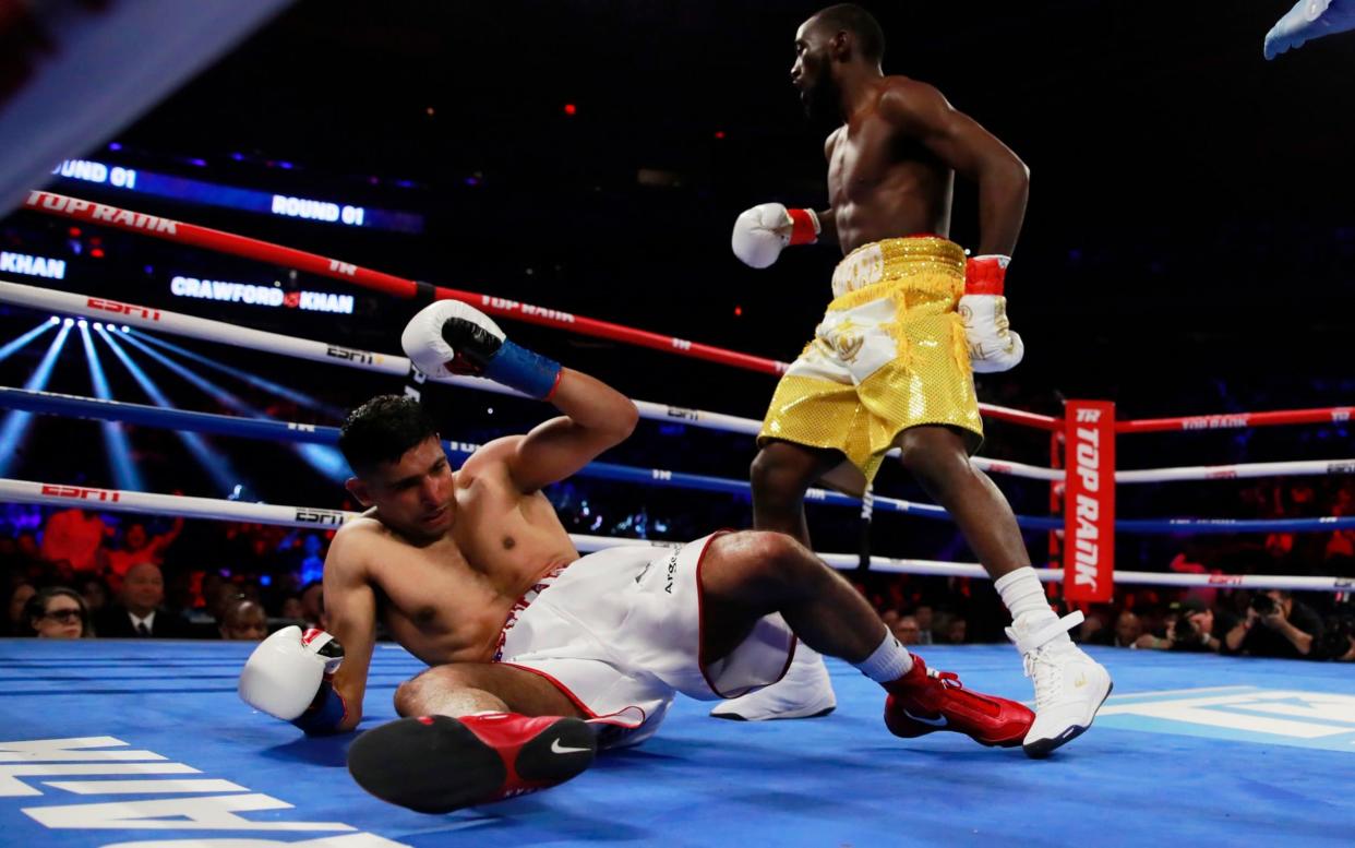 Amir Khan collapses to the floor - Action Images via Reuters