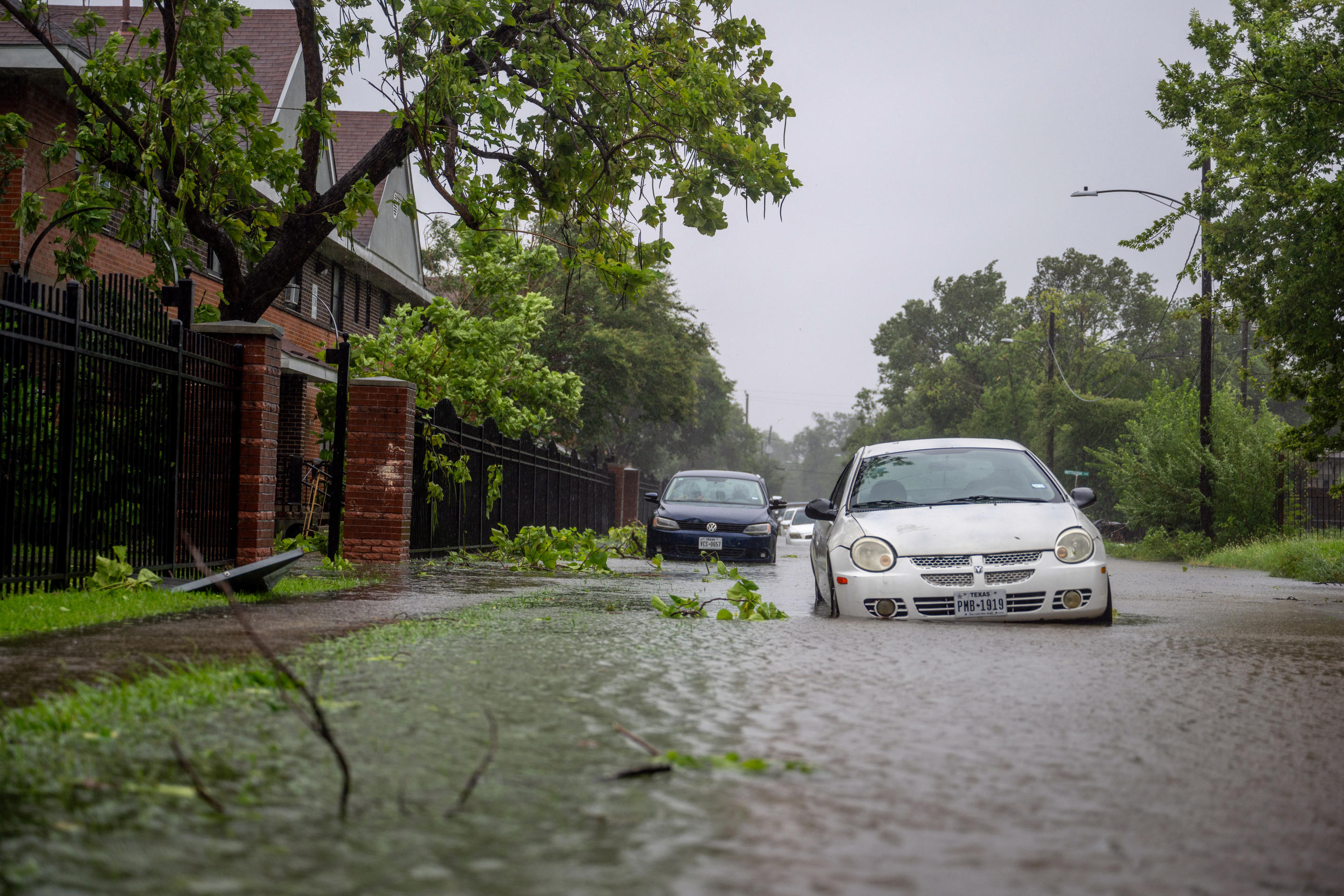 Vehicles sit in floodwaters in Houston on Monday.