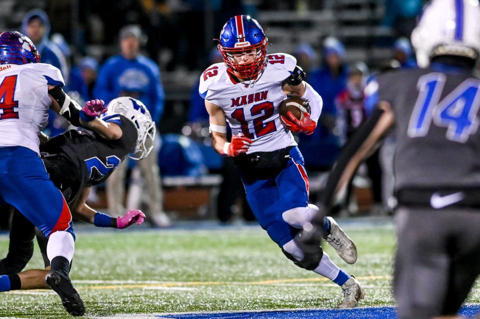 Mason's Tyler Baker runs after a catch against Walled Lake Western during the first quarter on Friday, Nov. 10, 2023, at Walled Lake Western High School.