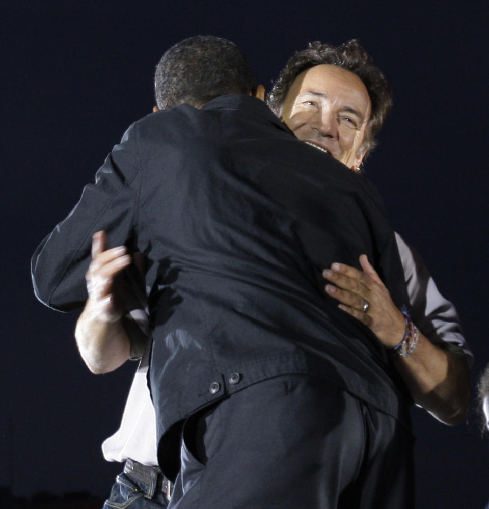 FILE - In this Nov. 2, 2008, file photo Bruce Springsteen hugs presidential candidate Barack Obama during a performance at an outdoor campaign rally at the Cleveland Mall, in Cleveland, Ohio. Springsteen is hitting the campaign trail again on President Barack Obama's behalf, and he'll be joined this time by former President Bill Clinton at a rally in Parma, Ohio, Thursday, Oct. 18, 2012. (AP Photo/Alex Brandon, File)