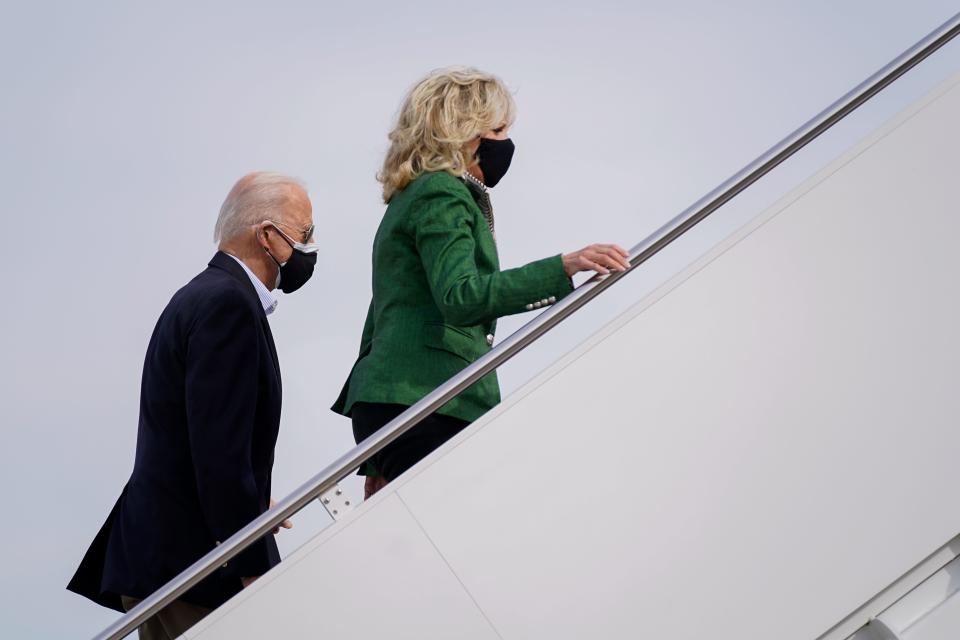 President Joe Biden and first lady Jill Biden board Air Force One at Andrews Air Force Base, Md., Friday, Feb. 26, 2021. They are en route to Houston to survey damage caused by severe winter weather and encourage people to get their coronavirus shots. (AP Photo/Patrick Semansky) ORG XMIT: MDPS103