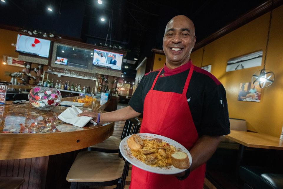 Charles Charles Smith at Loveys Seafood & Grill presents Hilly City pasta in the Vicksburg, Miss., restaurant Thursday, Oct. 19, 2023, bringing back his blend of Southern and Creole flavors to his hometown. The dish includes andouille sausage, shrimp and crawfish sauteed with bell peppers, wine and creole seasoning over linguini pasta.