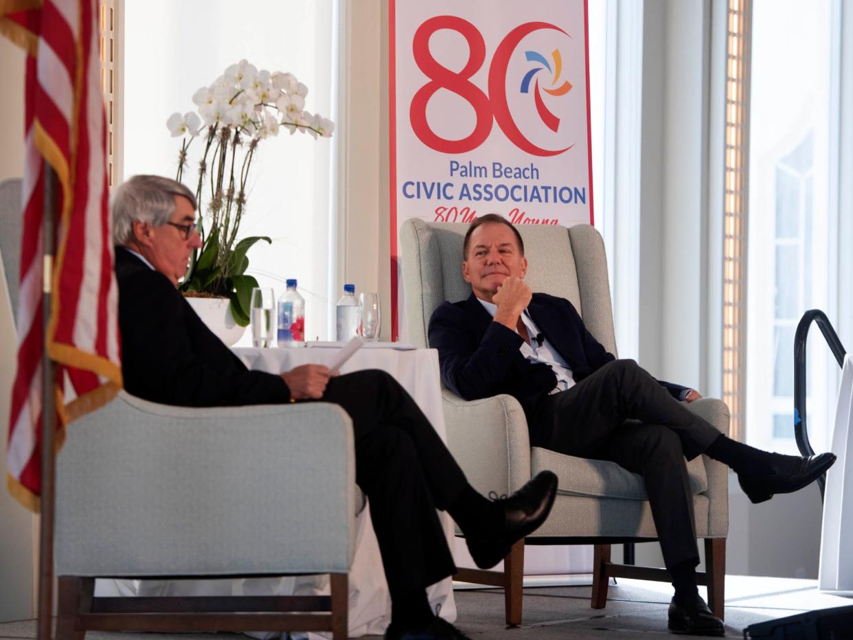 Palm Beach Civic Association Chairman Michael Pucillo, left, interviews Paul Tudor Jones II during the Civic Association's Signature Speaker Series at The Beach Club on Thursday.