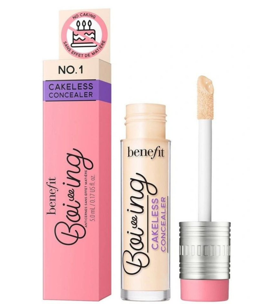 Open tube of Benefit Boi-ing Cakeless Full Coverage Concealer from Myer with a wand applicator and its pink and purple box.