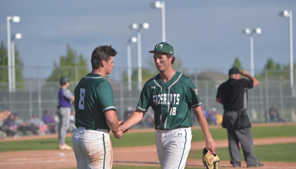 Fossil Ridge's Zander Reese (8) consoles pitcher Tyler Kubat (18) after Kubat was removed from the game against Douglas County on Sunday, May 22, 2022, at Fossil Ridge High School.