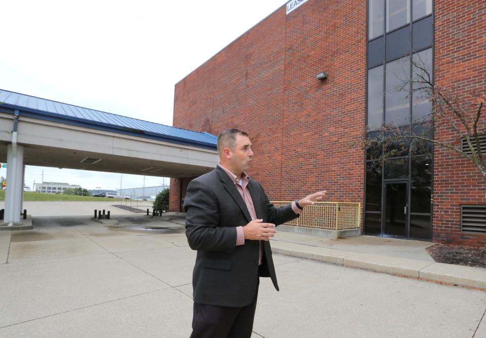 Barberton Mayor Bill Judge speaks outside the former First Merit building on West Tuscarawas Avenue in September, Barberton plans to convert the building into a new City Hall.