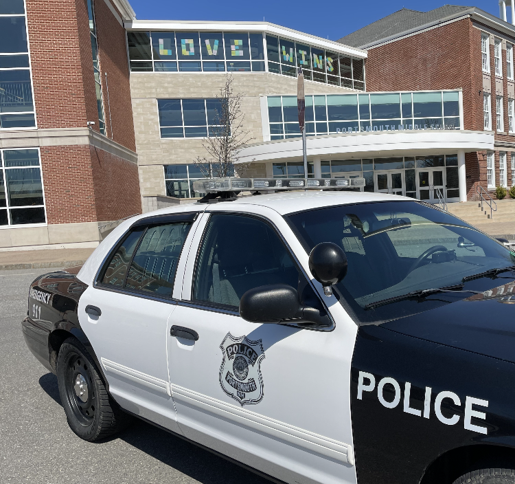 A city police cruisier is seen outside Portsmouth Middle School Thursday, April 13, 2023, as the school was closed following a shooting threat made on social media against Portsmouth High School.