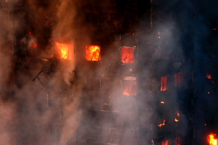 Huge flames have engulfed the tower (Picture: SWNS)