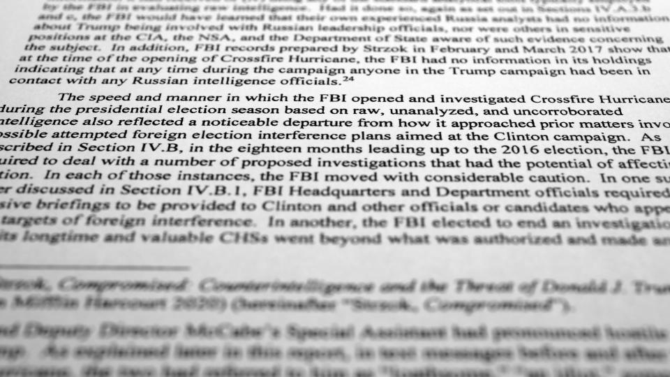 The final report by special prosecutor John Durham is photographed Monday, May 15, 2023. Durham ended his four-year investigation into possible FBI misconduct in its probe of ties between Russia and Donald Trump's 2016 presidential campaign. The report offers withering criticism of the bureau but a meager court record that fell far short of the former president's prediction he would uncover the "crime of the century." (AP Photo/Jon Elswick)