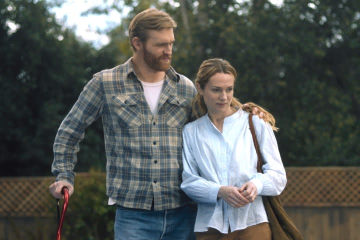 Wyatt Russell stands next to Kerry Condon in Night Swim.