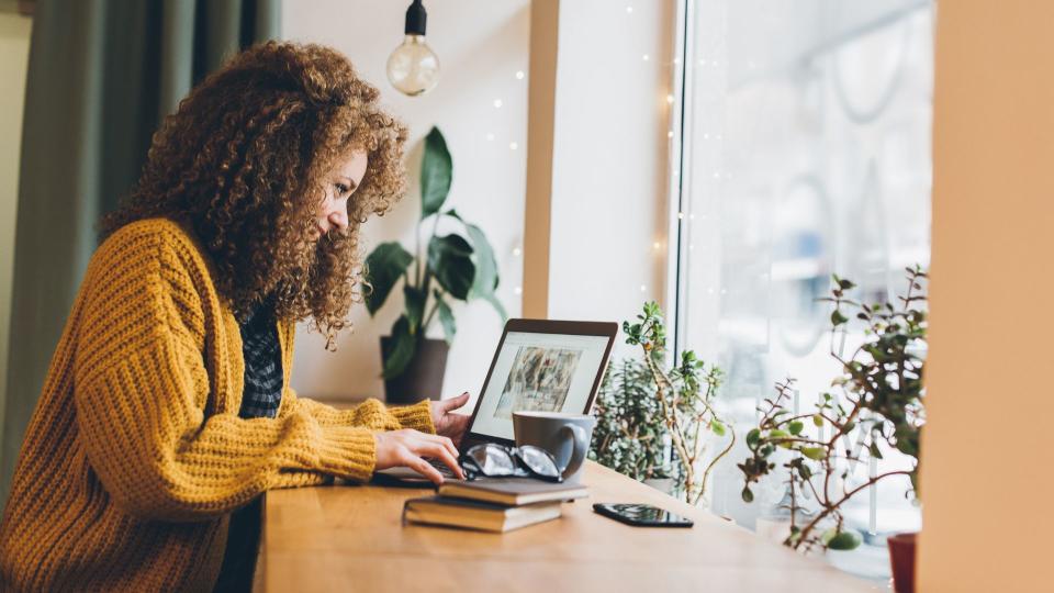 Young woman working on a laptop.