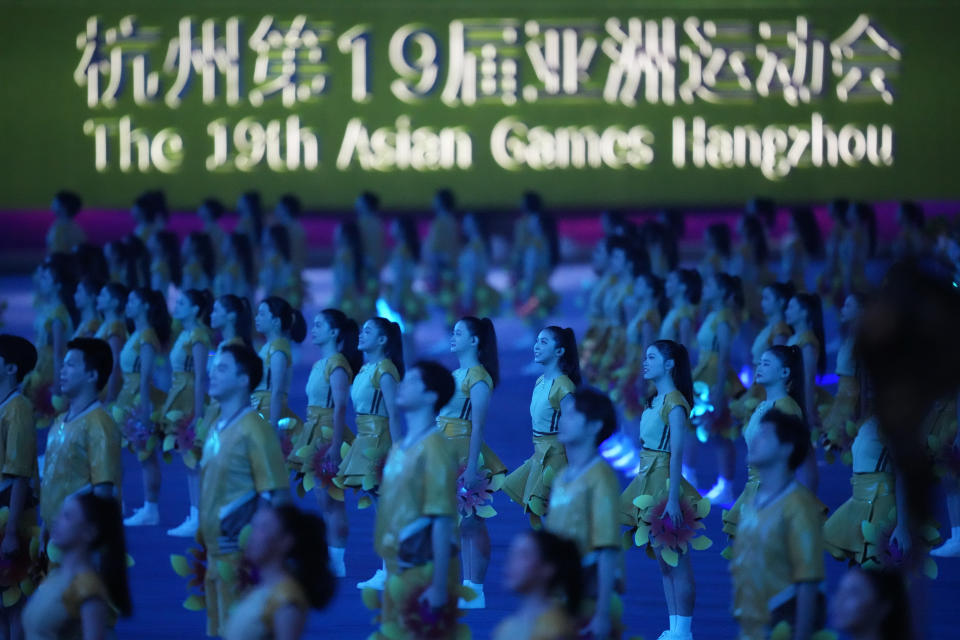 Performers prepare for the closing ceremony of the 19th Asian Games in Hangzhou, China, Sunday, Oct. 8, 2023. (AP Photo/Eugene Hoshiko)