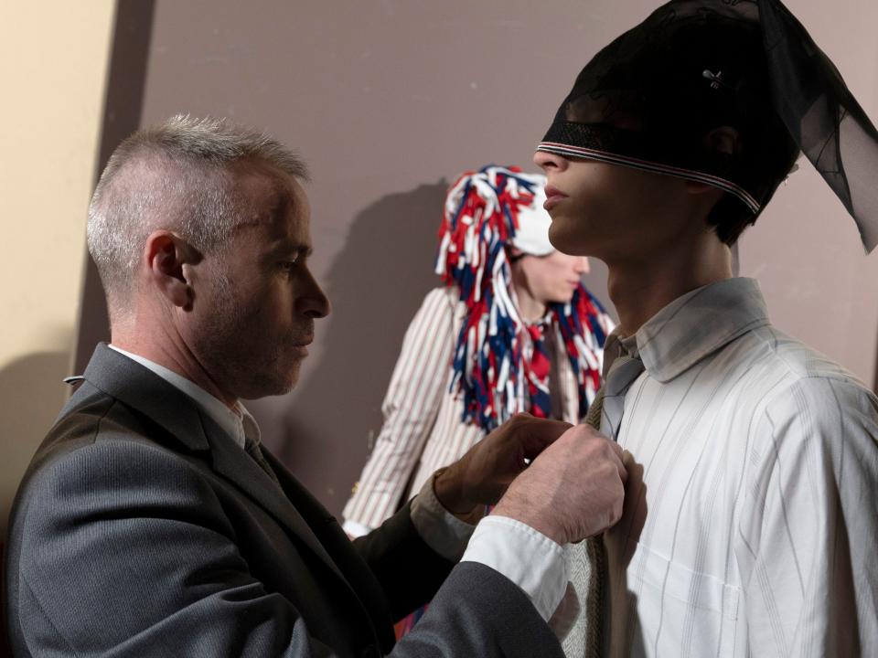 Thom Browne prepares a model backstage before the Thom Browne Womenswear Fall/Winter 2020/2021 show as part of Paris Fashion Week on March 01, 2020