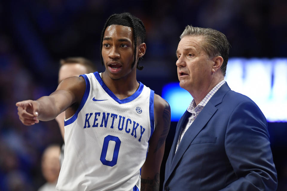 Kentucky head coach John Calipari, right, talks with guard Rob Dillingham (0) during the second half of an NCAA college basketball game against Tennessee in Lexington, Ky., Saturday, Feb. 3, 2024. Tennessee won 103-92. (AP Photo/Timothy D. Easley)