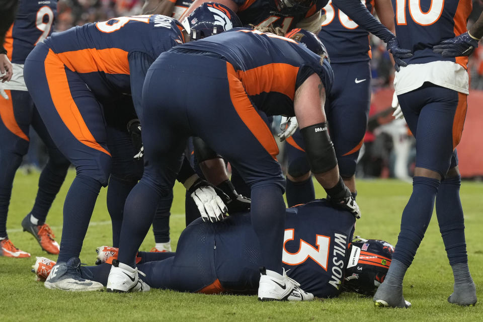 Denver Broncos quarterback Russell Wilson (3) is on the ground after being hit during the second half of an NFL football game against the Kansas City Chiefs Sunday, Dec. 11, 2022, in Denver. (AP Photo/David Zalubowski)
