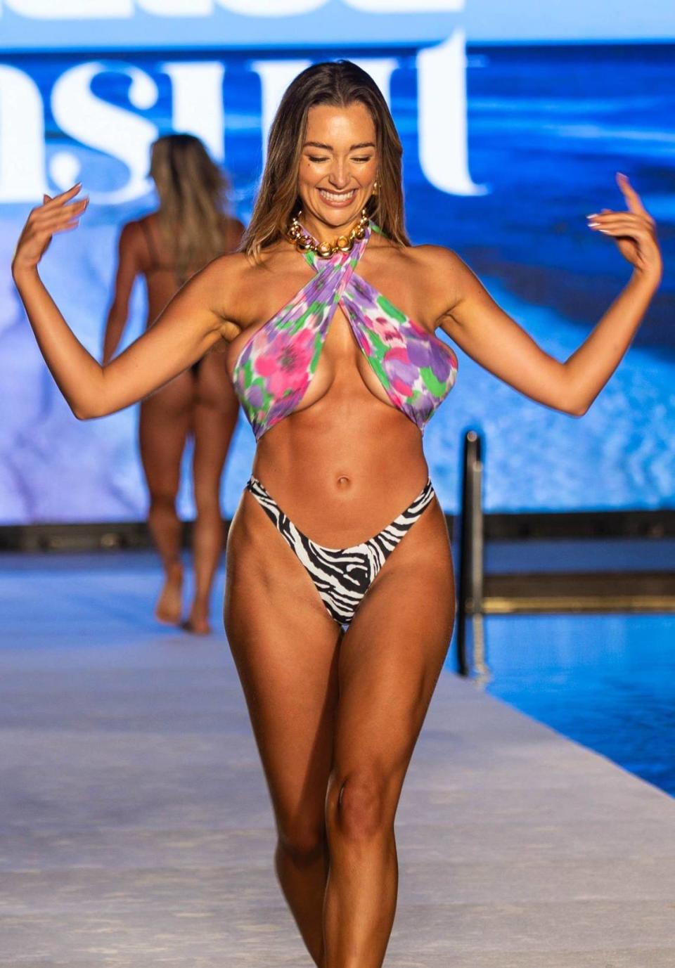 Model Penny Lane walks enthusiastically down the runway at the Sports Illustrated Swimwear show at the W South Beach hotel in Miami Beach, FL on Saturday, June 1, 2024.