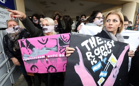 More than a dozen women from an association for the protection of women attended court wearing white scarves with an image of lips sewn shut printed on them.   - Credit: REX