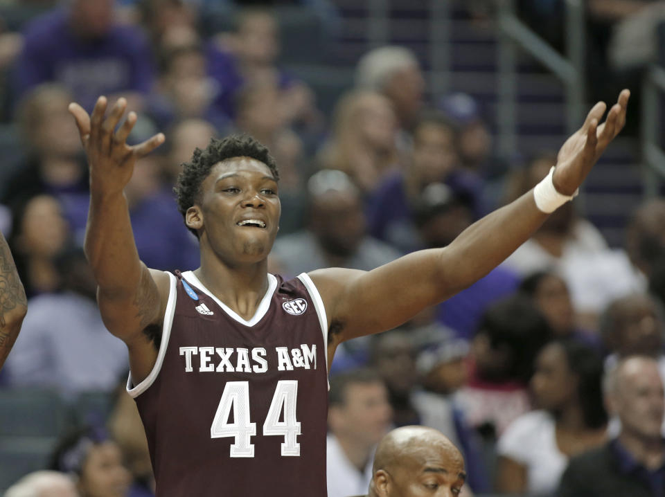 Texas A&M’s Robert Williams (44) celebrates on the bench during the second half of a second-round game against North Carolina in the NCAA men’s college basketball tournament in Charlotte, N.C., Sunday, March 18, 2018. (AP Photo/Bob Leverone)