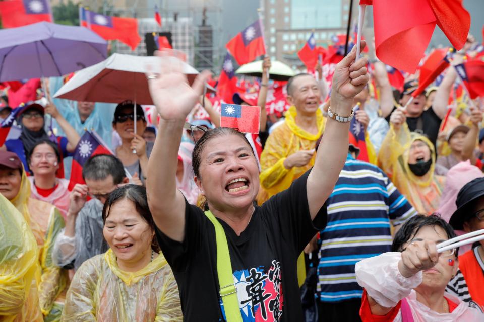 Supporters of Kaohsiung city mayor Han Kuo-yu from the Kuomintang party wave Taiwanese flags during a campaign event in Taipei on June 1, 2019. (Photo by Daniel Shih / AFP)        (Photo credit should read DANIEL SHIH/AFP/Getty Images)