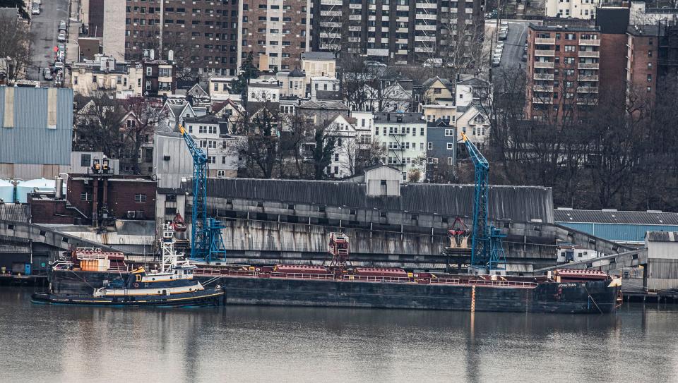 Raw sugar is transferred from a barge on the Hudson River to the Domino Sugar Refinery in Yonkers March 27, 2024. According to Domino, forty vessels a year deliver more than 515,000 tons of raw sugar to the refinery, which gets refined at a rate of more than 4.3 million pounds of sugar a day. Almost all the raw sugar that arrives at the Yonkers plant comes from Florida.