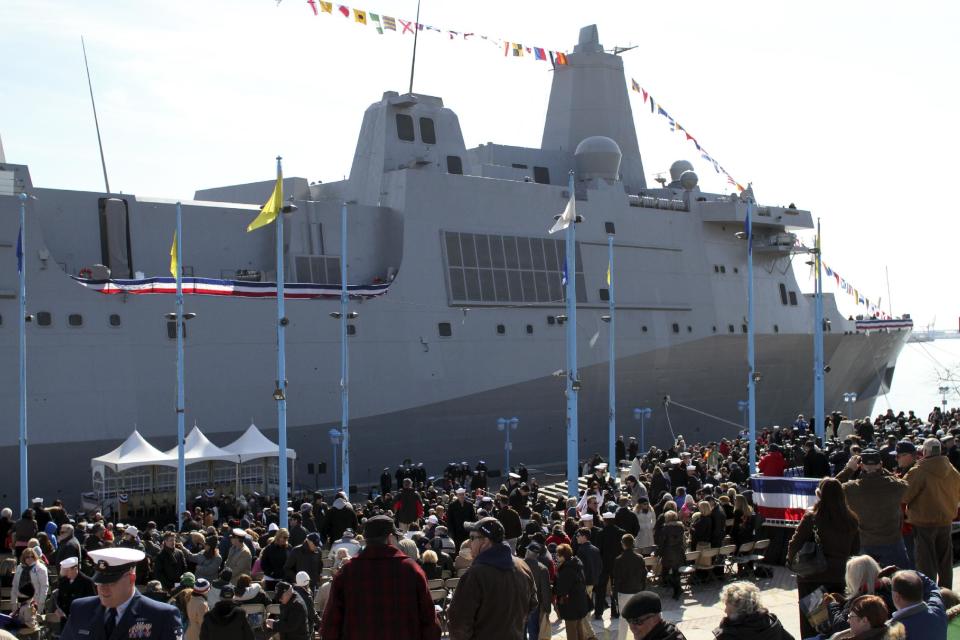 Audience members gather before the start of a commissioning ceremony for the USS Somerset (LPD 25) Saturday, March 1, 2014, in Philadelphia. The USS Somerset is the ninth San Antonio-class amphibious transport dock and the third of three ships named in honor of those victims and first responders of the attacks on the World Trade Center and the Pentagon. The ship is named for the county where Flight 93 crashed after being hijacked on Sept. 11, 2001. (AP Photo/ Joseph Kaczmarek)