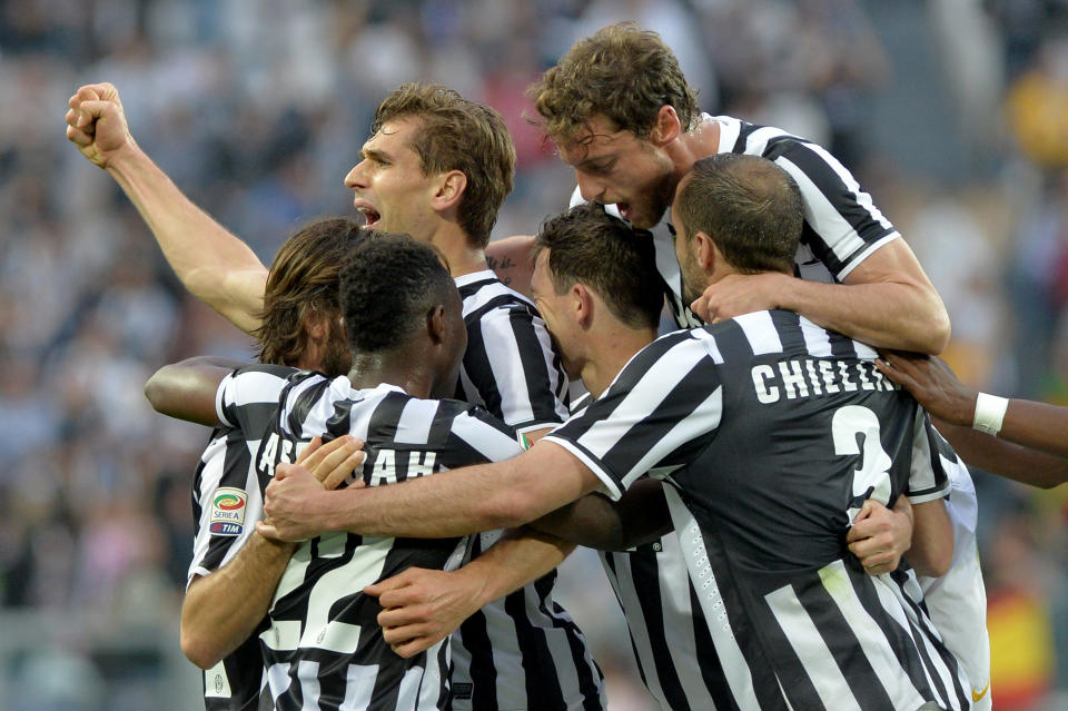 Juventus forward Fernando Llorente, of Spain, top left, celebrates after scoring with teammates during a Serie A soccer match between Juventus and Livorno at the Juventus stadium, in Turin, Italy, Monday, April 7, 2014. (AP Photo/Massimo Pinca)